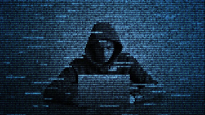 hacker image of hacker person at a computer